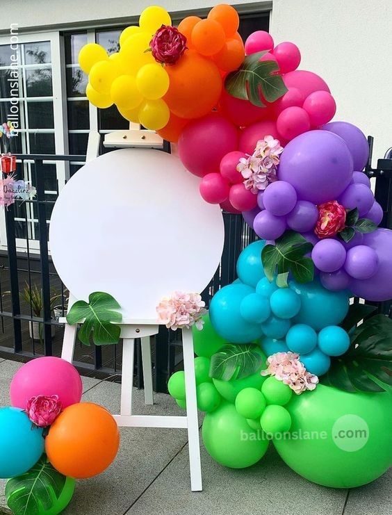 Balloons Lane in NYC creates festive Easter party decorations using colorful balloon bouquets with chrome flowers in shades of light green, red, purple, gold, and dark green.