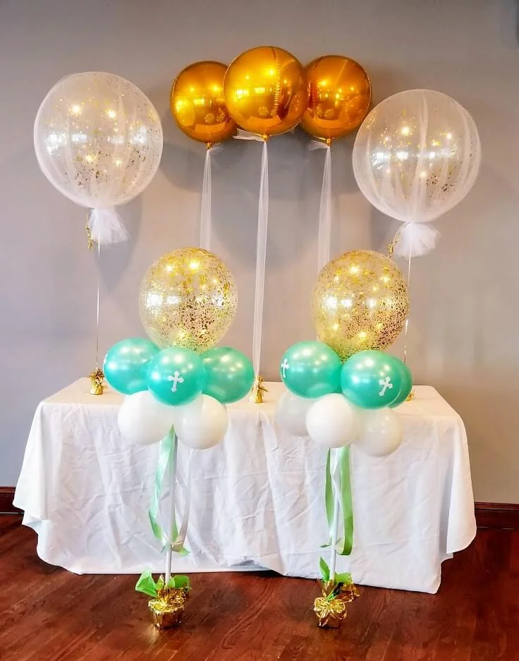 Baptism balloons are set for tables and first birthday celebrations in NJ, featuring a charming and festive display.