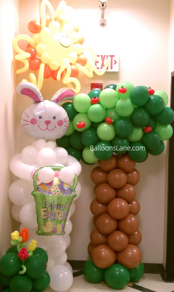 Immerse yourself in the beauty of Easter with this stunning decor featuring balloon trees, bunny with green basket balloons, sun balloon flowers, and themed elements in NJ.