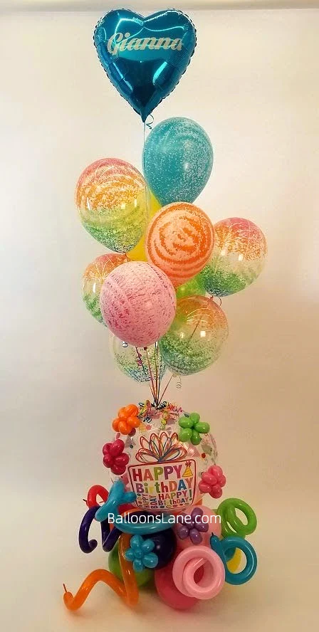 Personalized balloon bouquets with pink, blue, and purple confetti balloons, accompanied by pink balloons, in Brooklyn along with multi color twisted balloons.