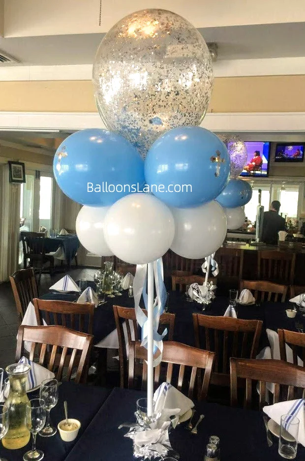 Christening balloons bouquet featuring pearl blue, white, and confetti balloons in Brooklyn.