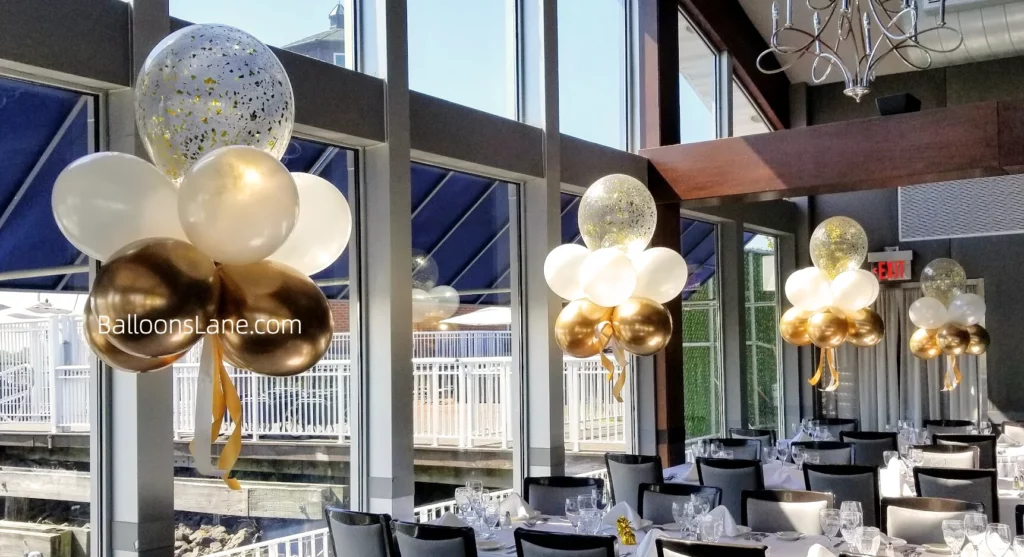 Floating balloons featuring confetti, white and gold chrome balloons to celebrate birthday, baptism, or anniversary in NYC