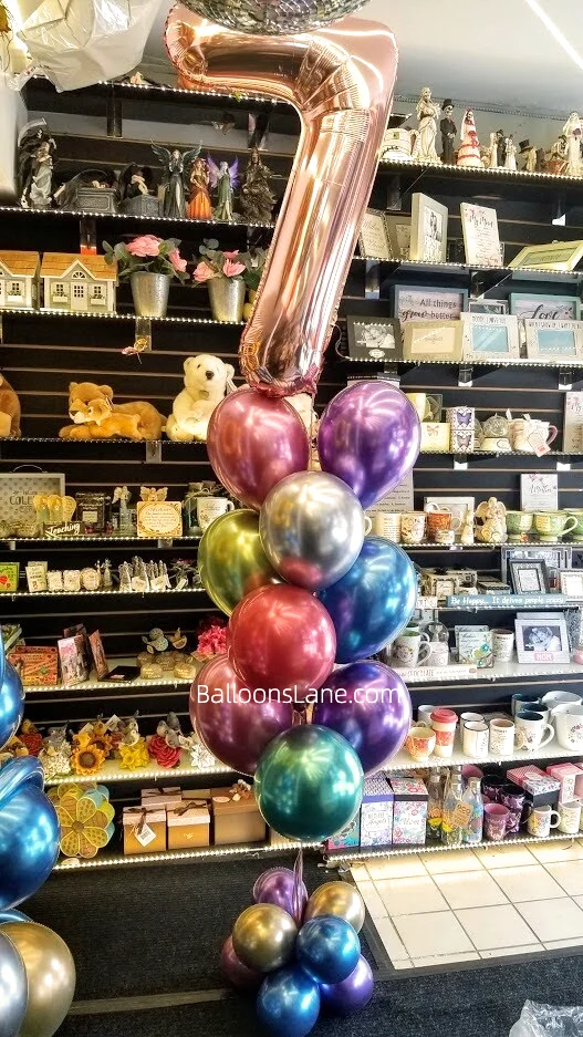 Rose gold 7 Number Balloon with gold, silver, green, purple, pink, and blue balloon bouquets to celebrate 7th birthday in NJ