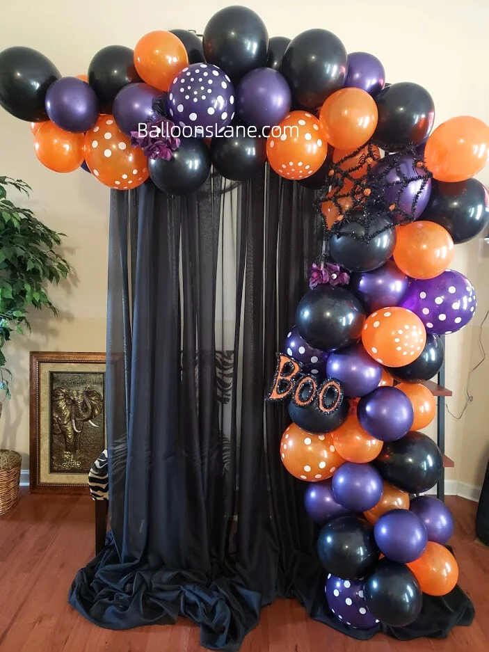 Half arch of Halloween-themed balloons to celebrate an indoor party in Manhattan.