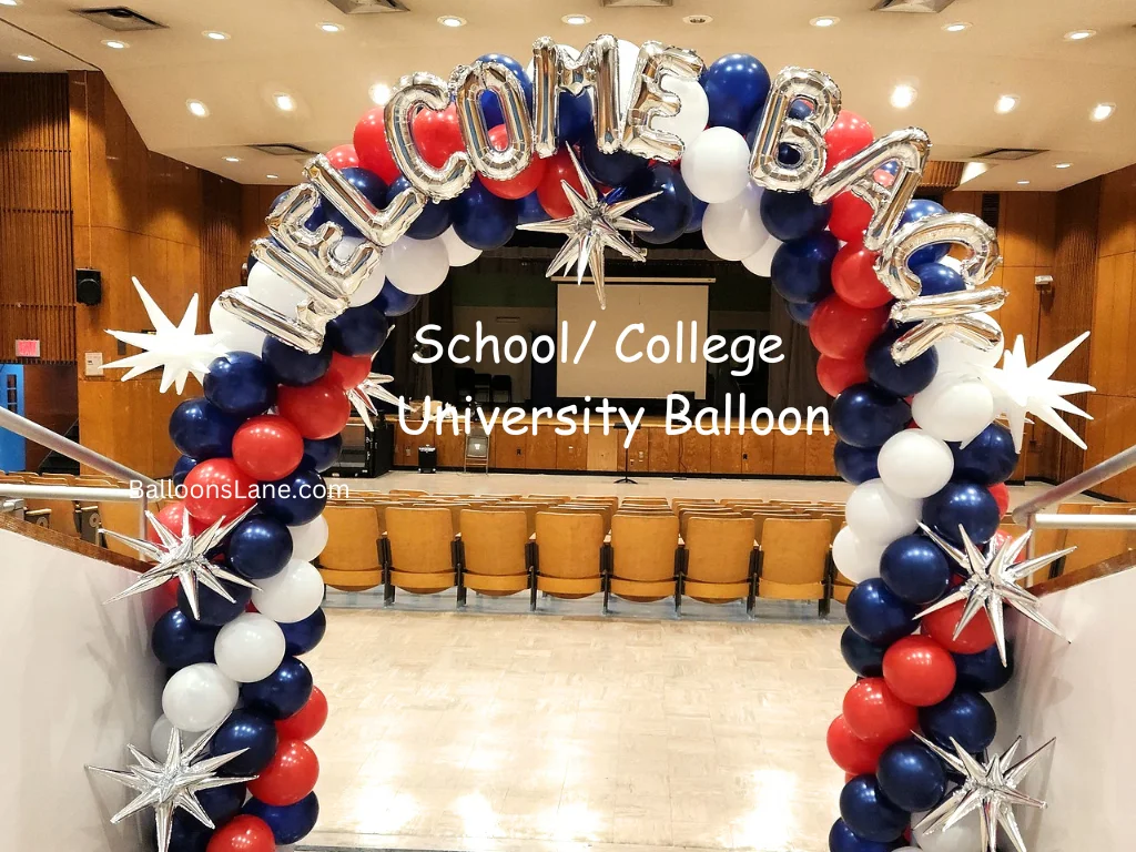 Welcome back to school foil balloons in silver, accompanied by a white star balloon and a red, white, and blue balloon arch in NYC