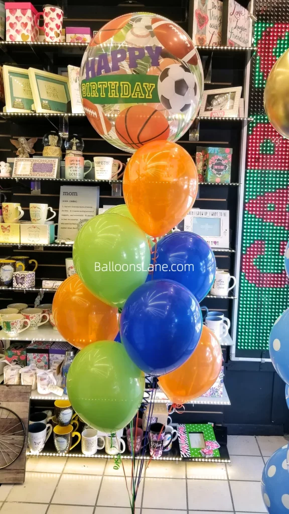 appy Birthday Customized Bubble Balloon Bouquet with Green, Orange, and Blue Balloons, and Blue and Green Accents in NJ