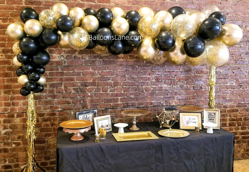 Chrome Gold, Black, and Confetti Balloon Garland Arch Decoration by Balloons Lane in Staten Island