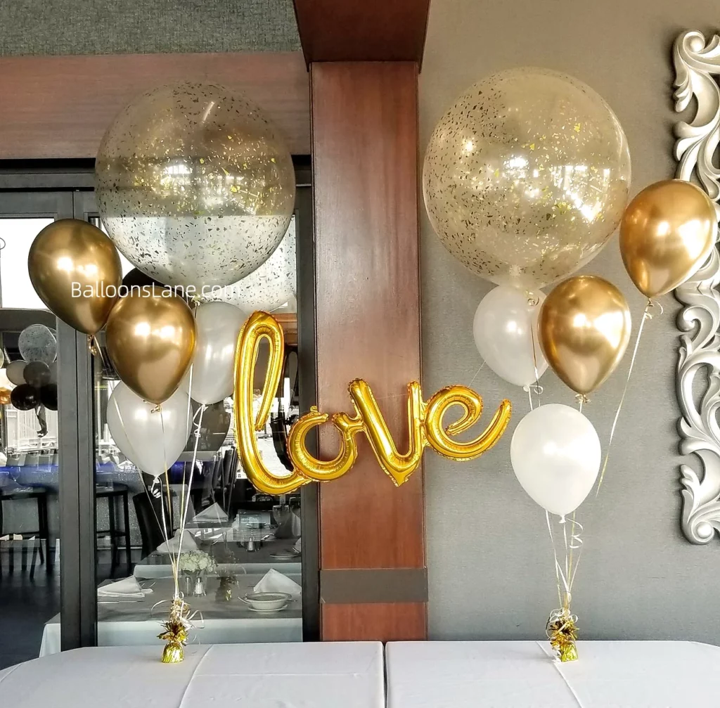 Love letter balloons accompanied by gold confetti balloons and white latex balloons in Brooklyn to celebrate an engagement party