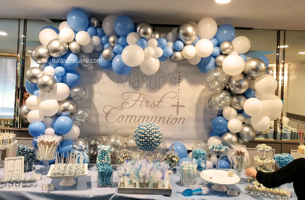 Balloon arch for communion of white, blue, silver, and confetti in NJ
