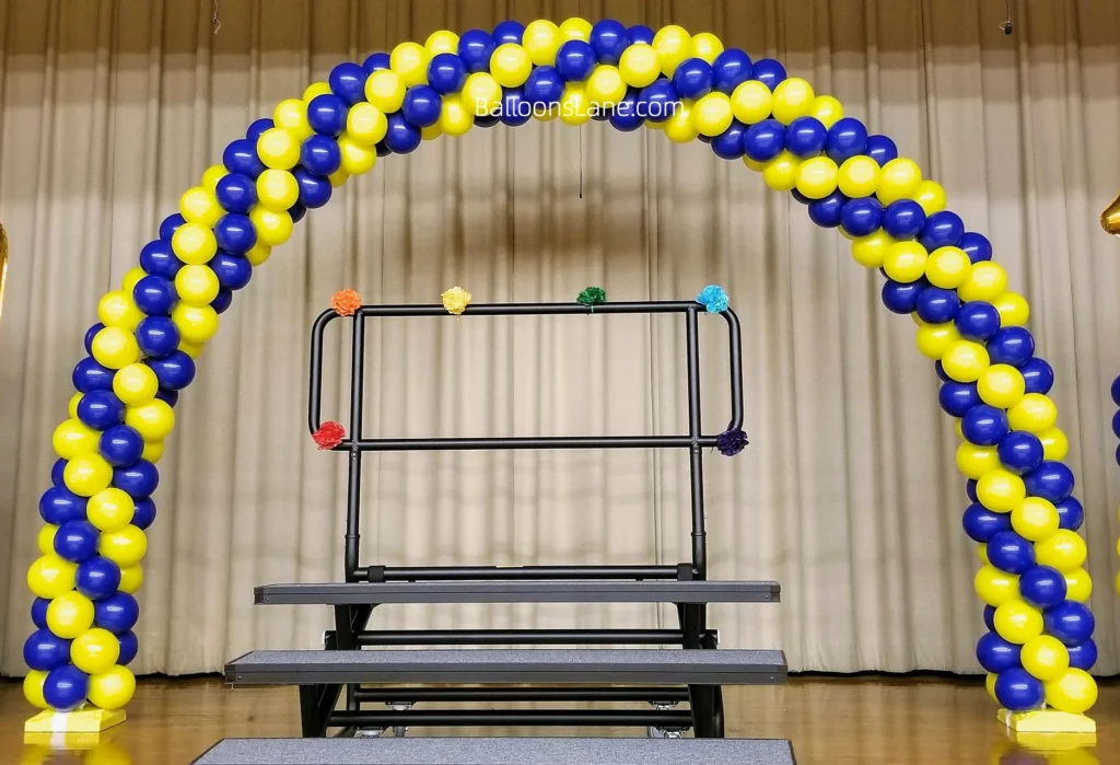 Arch made of yellow and blue balloons at the school.