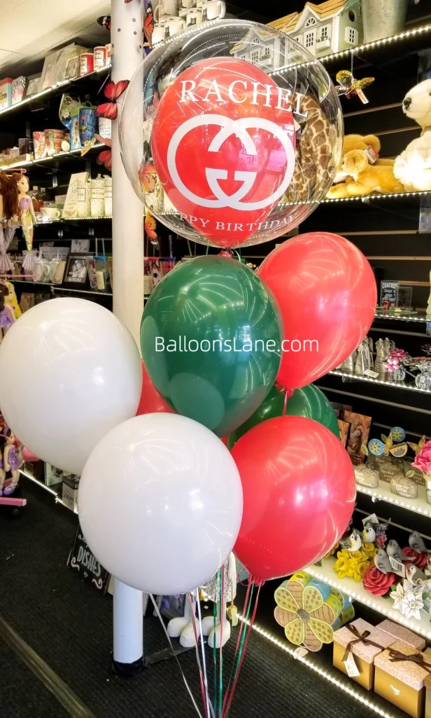 Personalized balloon bouquet featuring a bubble balloon, red, green, and white balloons in Brooklyn.