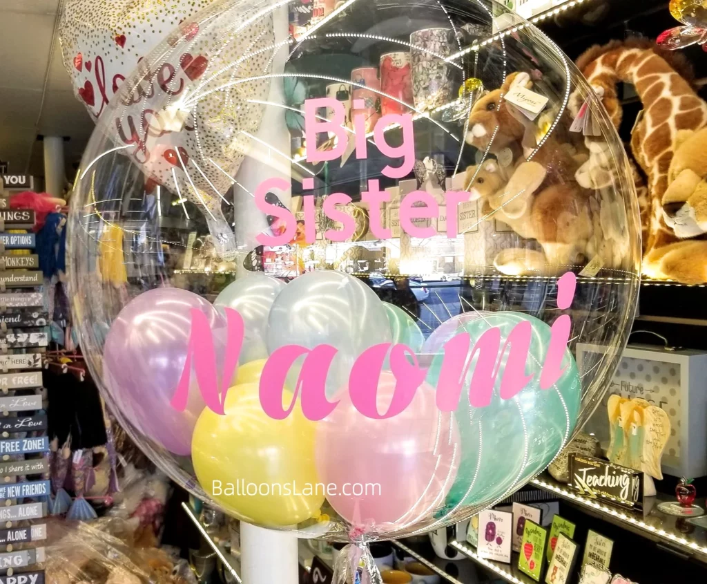 Bubble balloon gender reveals "It's a Girl" customized balloon in Brooklyn