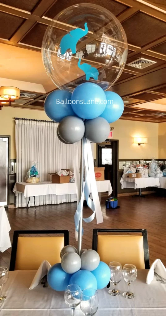 Elephant-themed bubble balloon with blue and grey balloons to celebrate communion in Brooklyn
