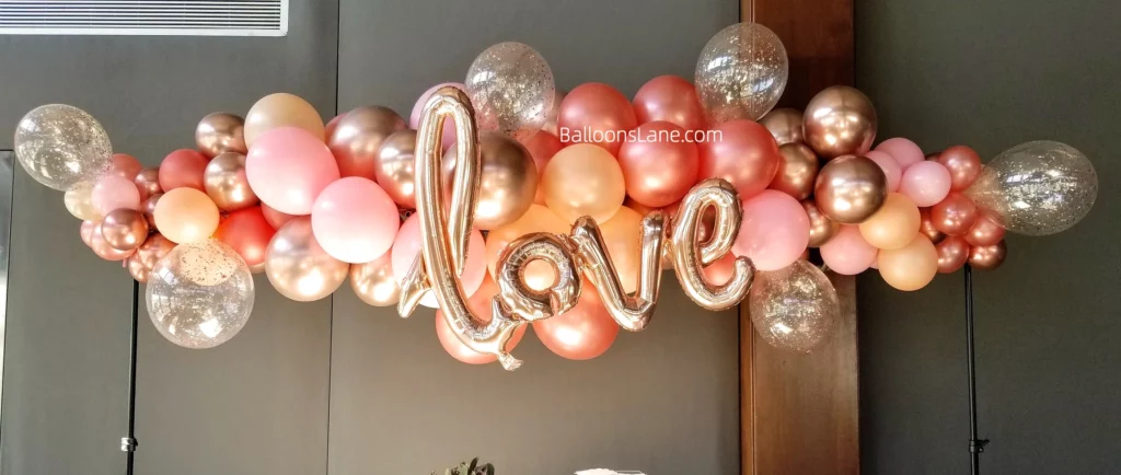Balloon Backdrop with Pink, Peach, Confetti, and Gold Latex Balloons, Along with Love Letter Balloons in New Jersey