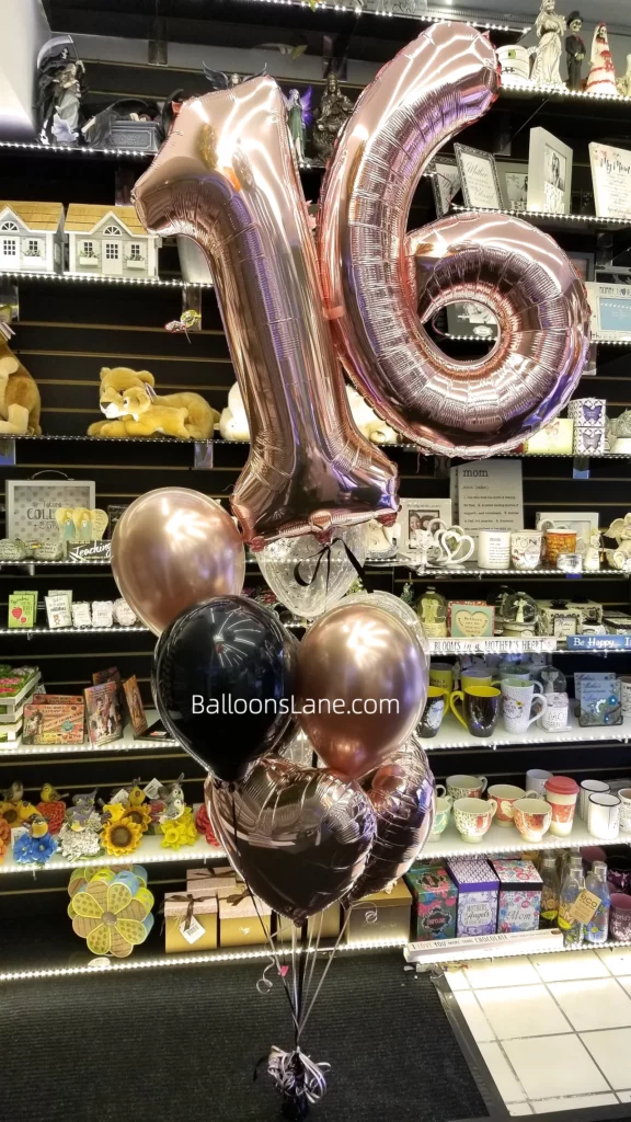 The bouquet arrangement featured sixteen number balloons, black and rose gold heart-shaped balloons, and pink confetti balloons.