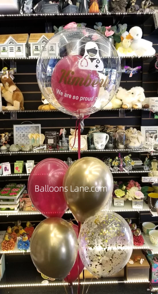 "We Are Proud of You" Balloon Bouquet with Pink, Gold Latex, and Gold Confetti Balloons in NY