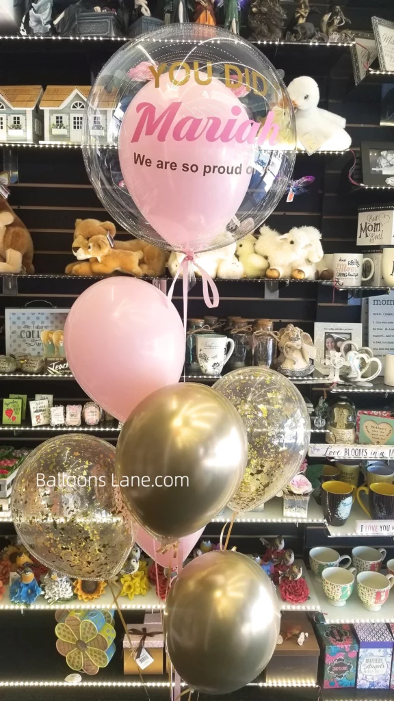 Celebrate success in New Jersey with this customized "You Did It" balloon bouquet, adorned with gold and pink balloons, latex balloons, and a gold confetti balloon!