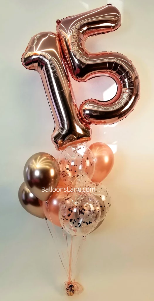 15 large number balloon in rose gold with matching colored latex and confetti balloons arranged in bouquet in Brooklyn.
