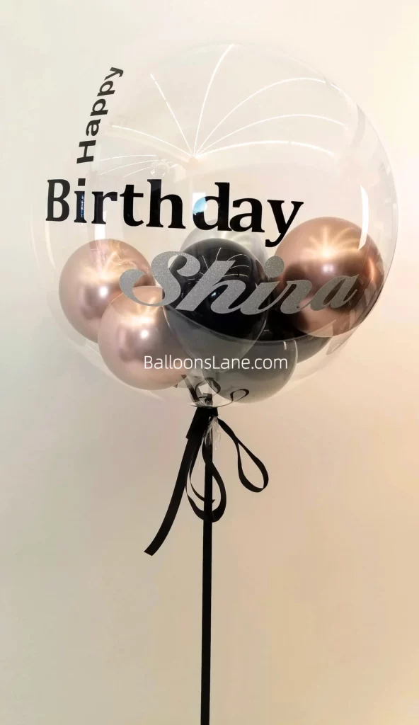 Feather Balloons with Customized 'Happy Birthday' Message, Rose Gold, and Black Balloons Inside to Celebrate Birthday Party in NYC