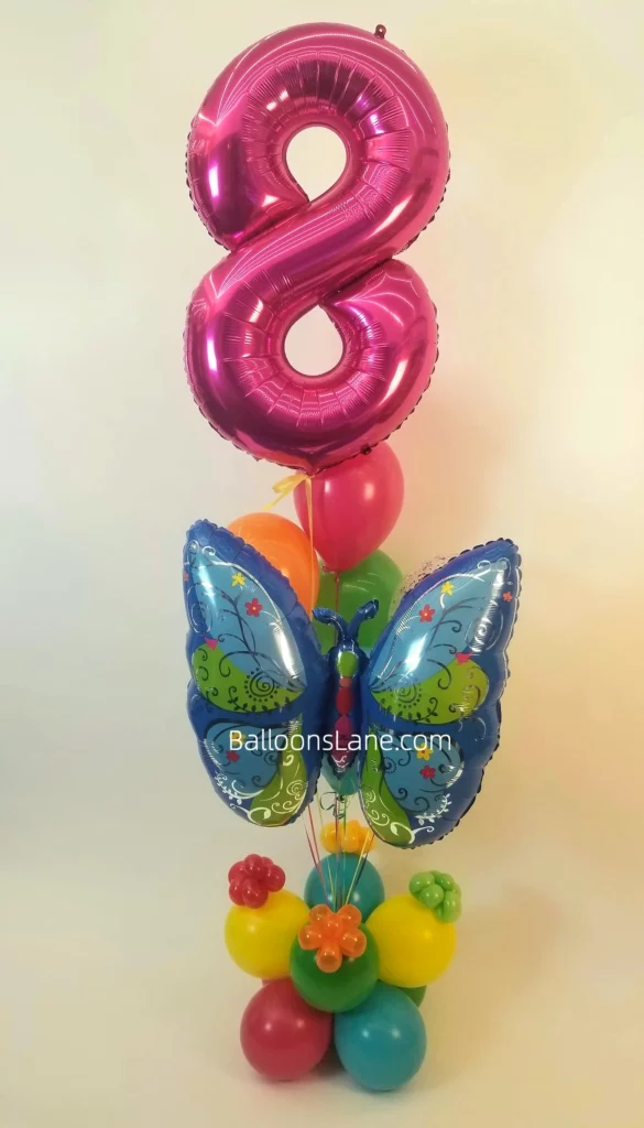 Pink number 8 balloons with butterfly balloons and yellow, green, blue, and red balloon column to celebrate your child's 8th birthday in New York City.