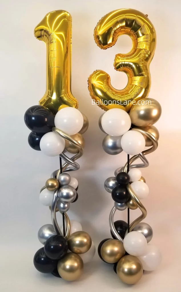 Number 1 and 3 latex number balloon stands accompanied by white, black, and gold balloons, along with twisted balloons, in Brooklyn.