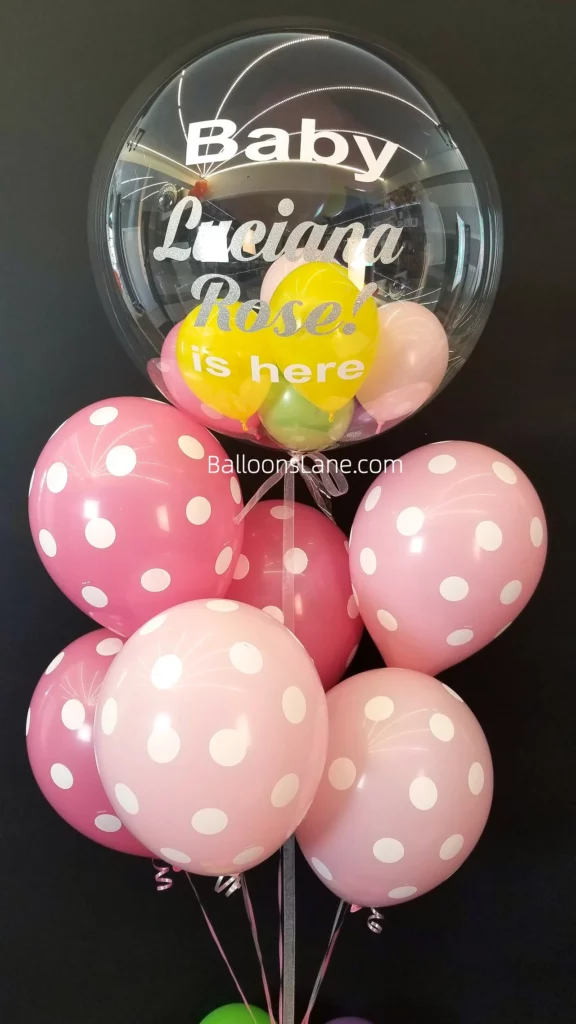 Bubble balloon customized for baby gender reveal along with pink polka dot balloon in NJ