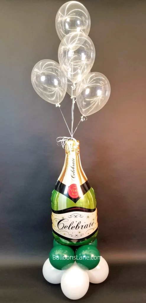 Clear balloons hanging above champagne bottle balloon in NJ