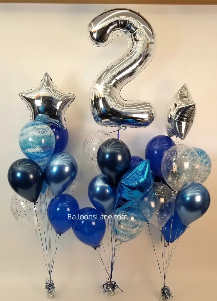 Number 2 silver balloon with star foil balloons, blue textured balloons, and confetti balloon bouquet in Manhattan.
