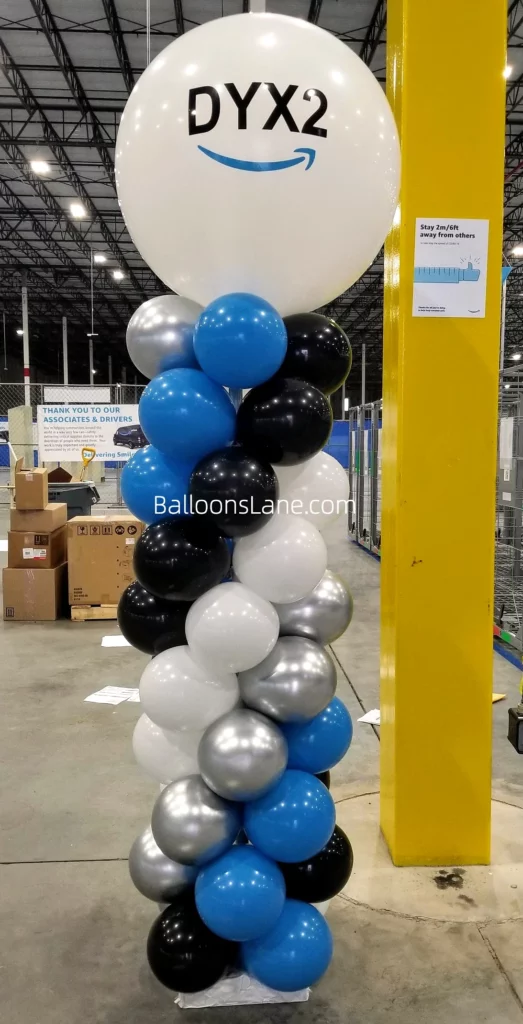Big White Customized Balloon Atop Blue, White, Black, and Silver Balloon Column in Brooklyn to Celebrate Birthday and Graduation