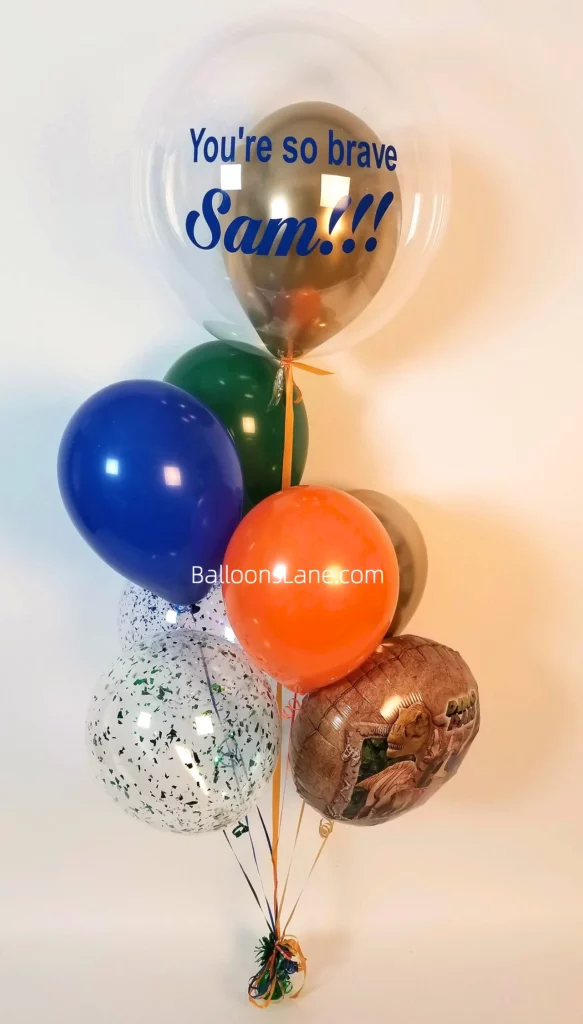 "You are so brave" personalized balloon bouquet featuring blue, green, brown, and striped printed balloons bouquet in NJ.