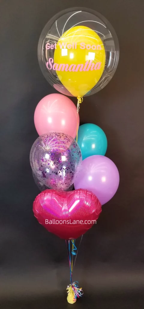 Personalized balloon bouquets with pink, blue, and purple confetti balloons, accompanied by pink balloons, in Brooklyn.