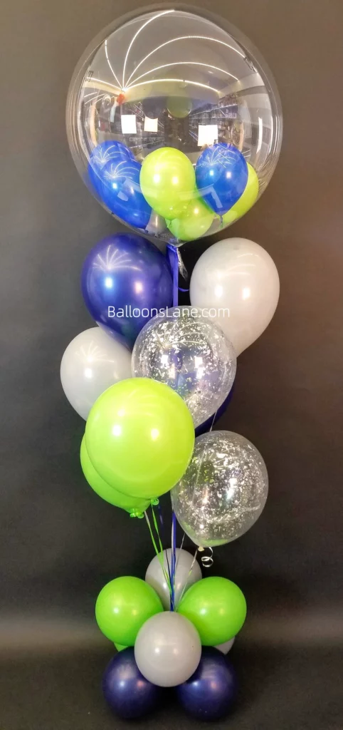Clear balloons filled with blue and green confetti, along with white balloons, for a gender reveal party in NJ.
