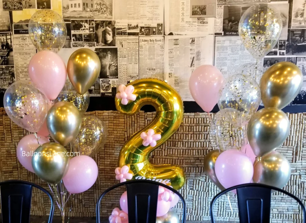 White and pink chrome gold confetti balloons with number 2 and pink hanging for baby's 2nd birthday party