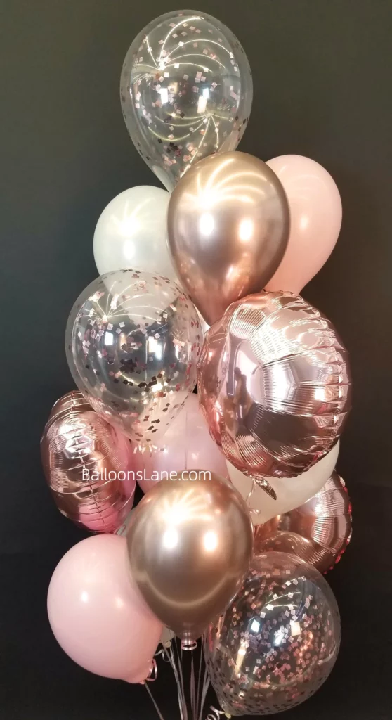 Pink, rose gold, white, and pink confetti balloon bouquet in Brooklyn to celebrate a birthday party.