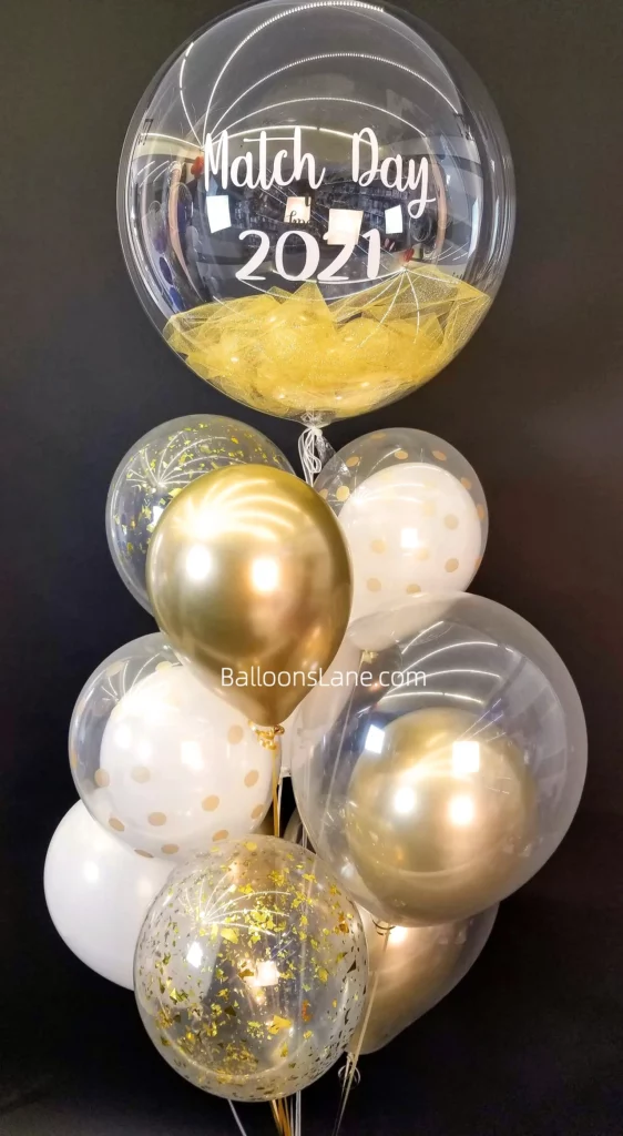 Custom Sports Day Balloon Bouquet by Balloon Lane: Featuring Gold Feather Balloon, White Latex Balloons, Dotted Balloon, and Gold Confetti Balloon in NYC
