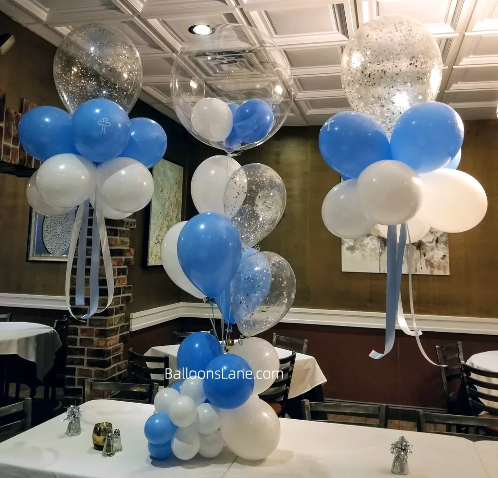 Christening balloons bouquet featuring pearl blue, white, and confetti balloons in Brooklyn.