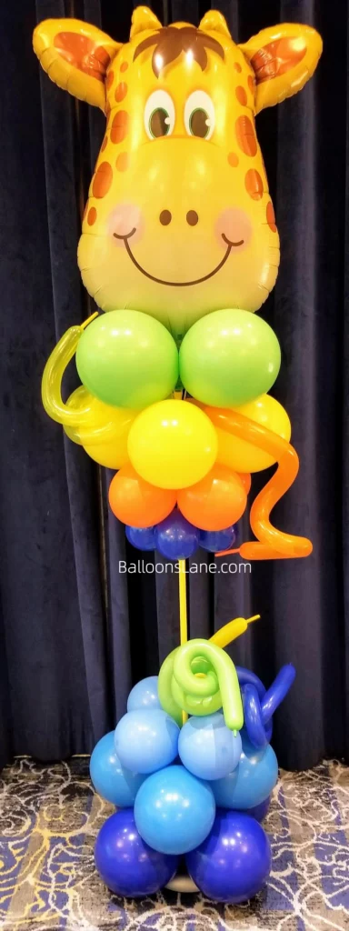 Safari Theme Balloon Stand with Green, Yellow, Orange, and Blue Balloons, and Twisted Orange Balloons in NYC to Celebrate Birthday