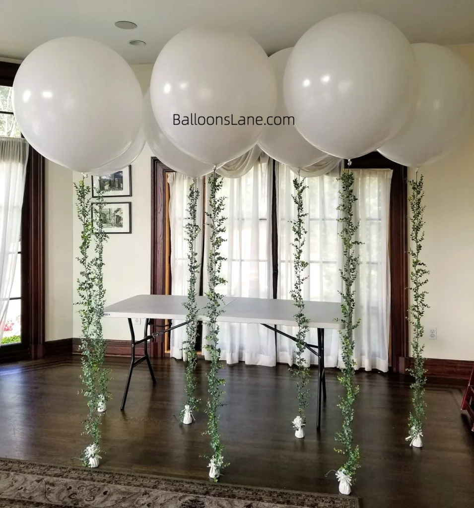 Large White Ceiling Balloons with Green Hangings for Celebrating Birthdays and More in Staten Island