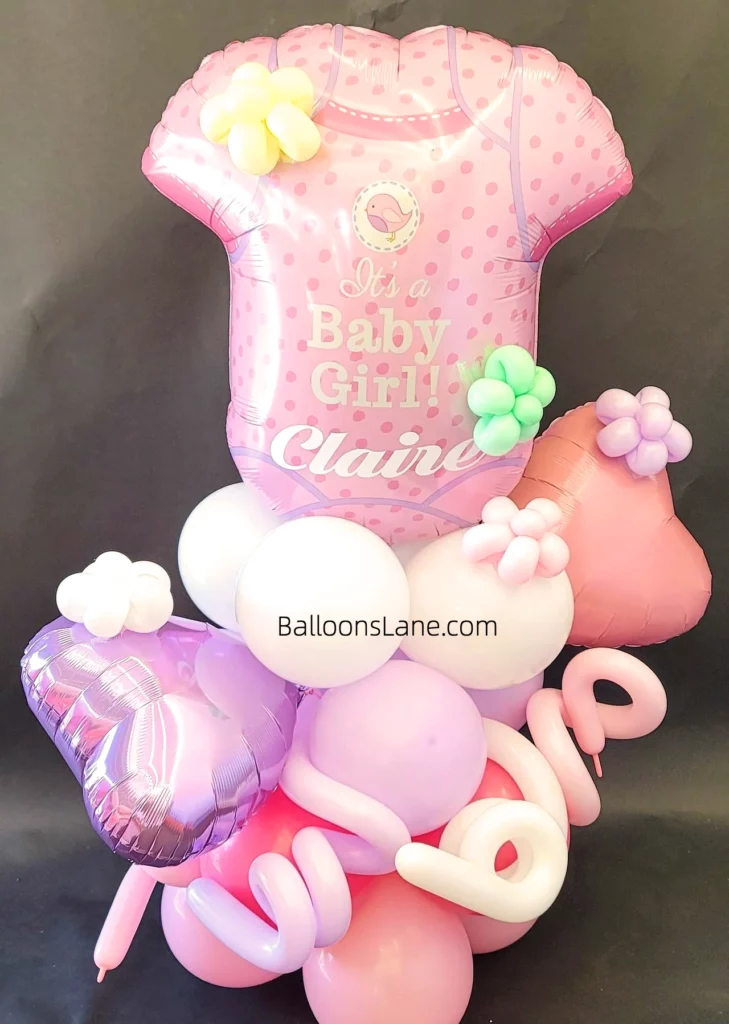 Pink, purple, and white gender reveal balloons with twisted balloons to celebrate in NJ.