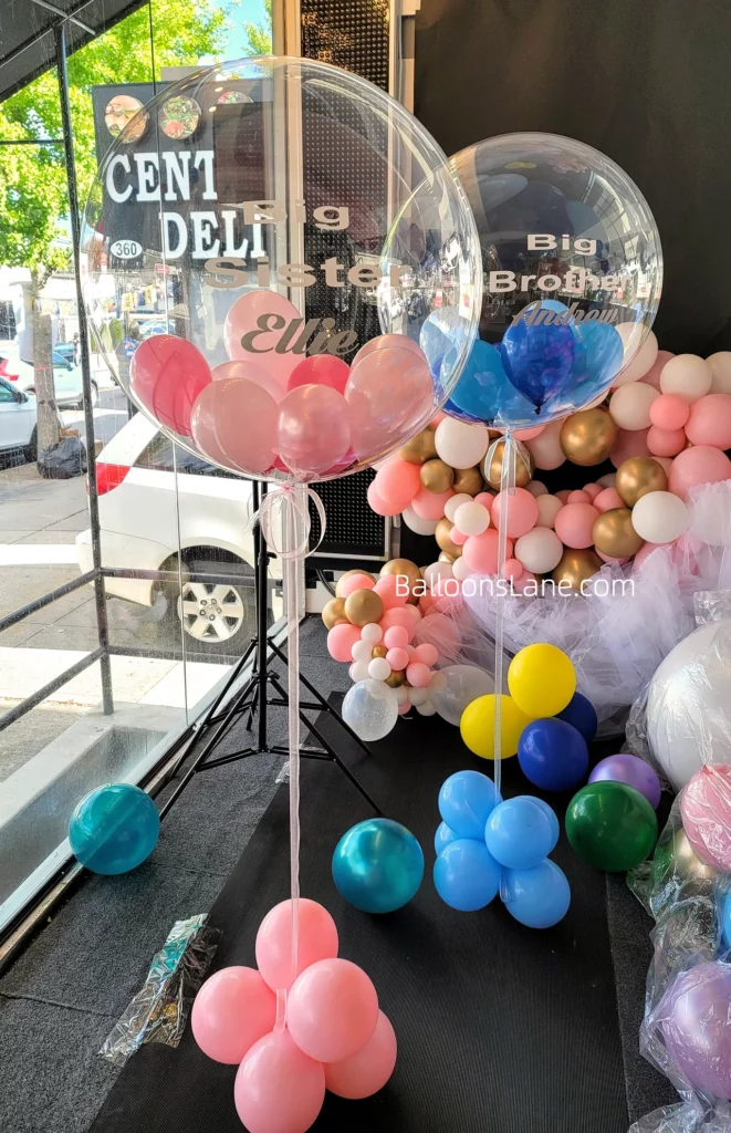 Gender reveal personalized balloon bouquet with pink and blue balloons in Manhattan