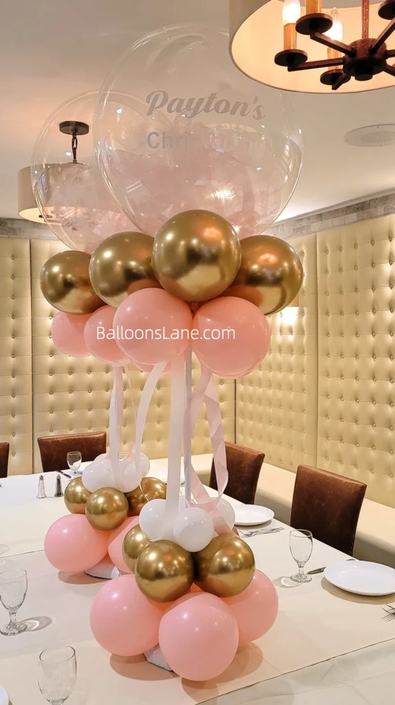 Clear personalized Communion balloon bouquet with gold and pink balloon stand in Staten Island