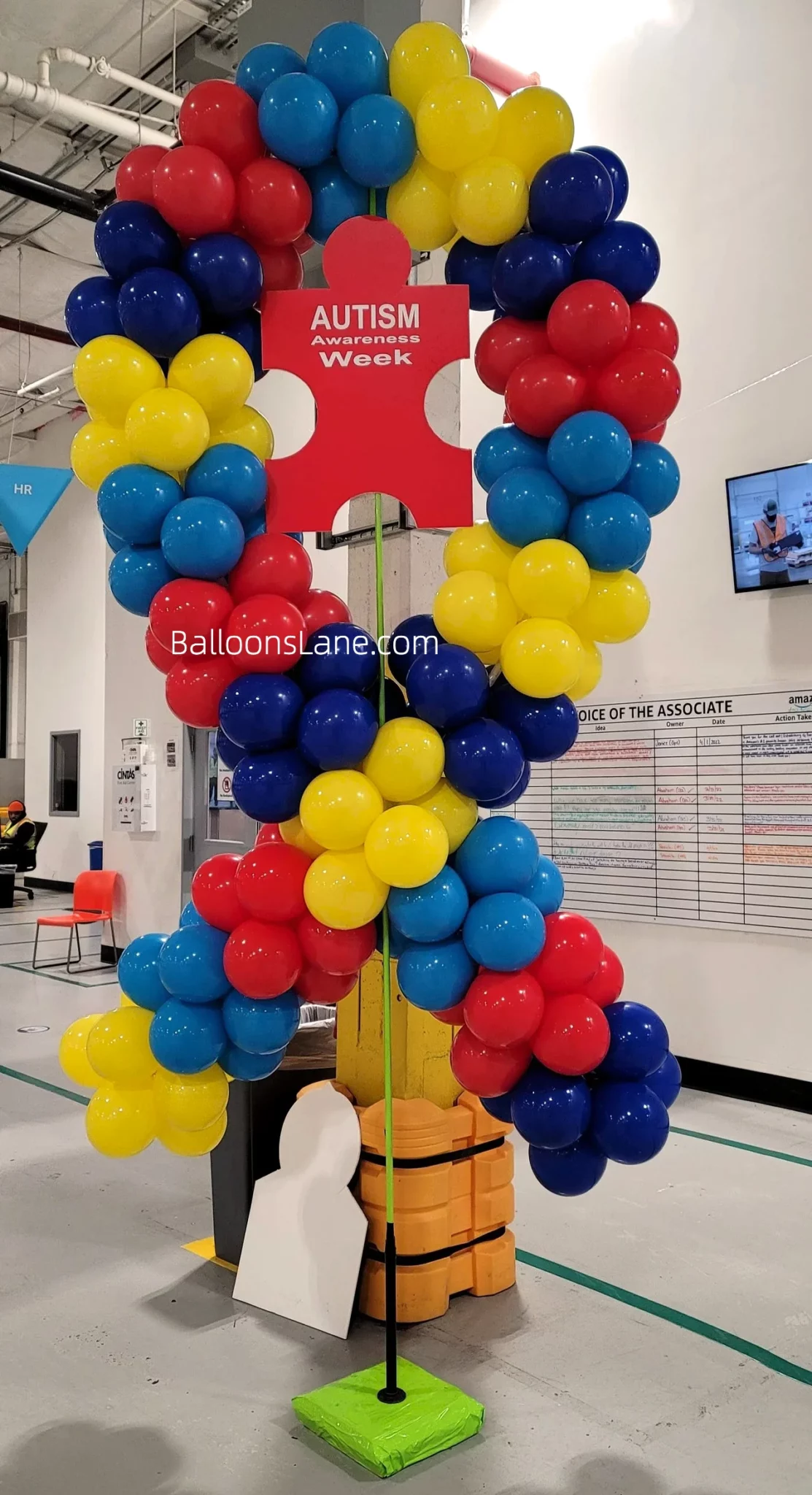 Multicolor bow-shaped balloon arrangement for Autism Awareness Week in NYC.