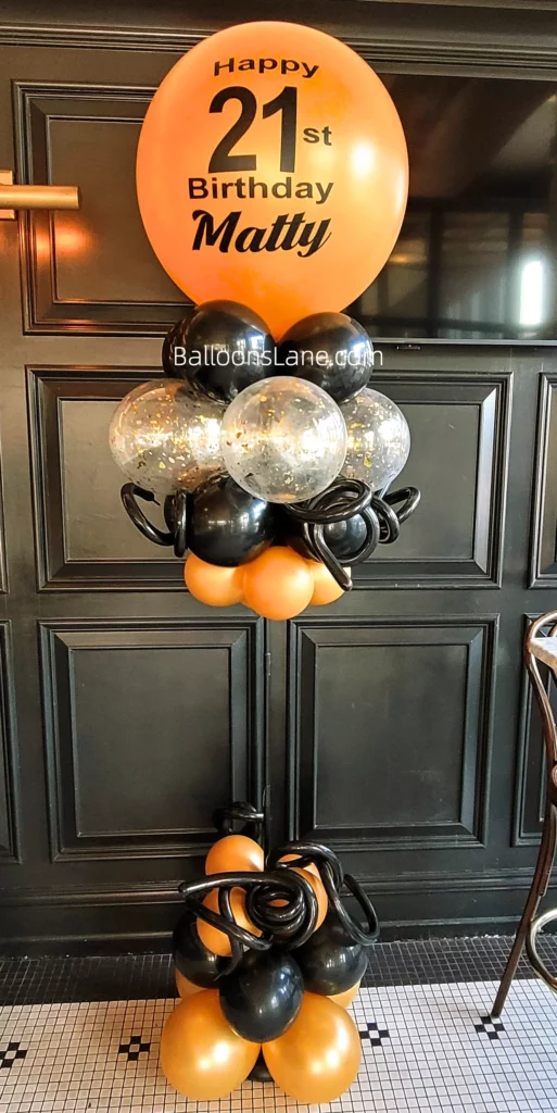21st Birthday Balloon Arrangement with Orange, Black, and Gold Confetti in Brooklyn