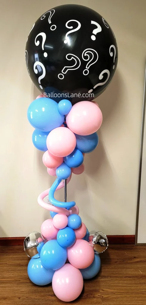 Gender reveal black balloon with pink and blue balloons, adorned with string balloons in bouquet in NJ
