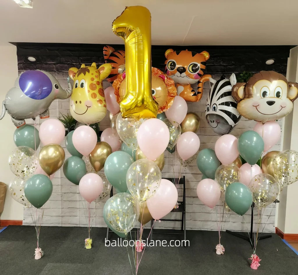 Safari theme balloon bouquet with gold number 1 balloon, confetti balloon, pink, and pastel green balloons arranged in Brooklyn to celebrate birthday