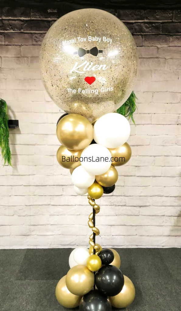 Customized balloon confetti in gold, white, and black colors with twisted balloons for wedding anniversary celebration in NJ.
