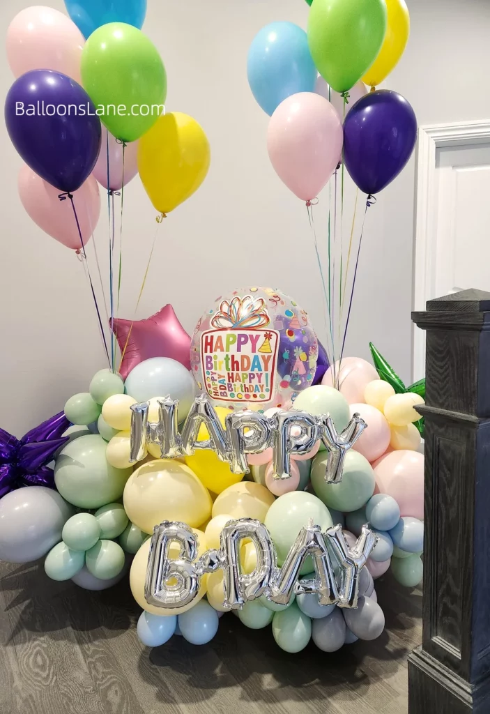 Customize happy birthday balloon bouquets in pastel colors including pink, blue, green, and yellow arranged in a bouquet.