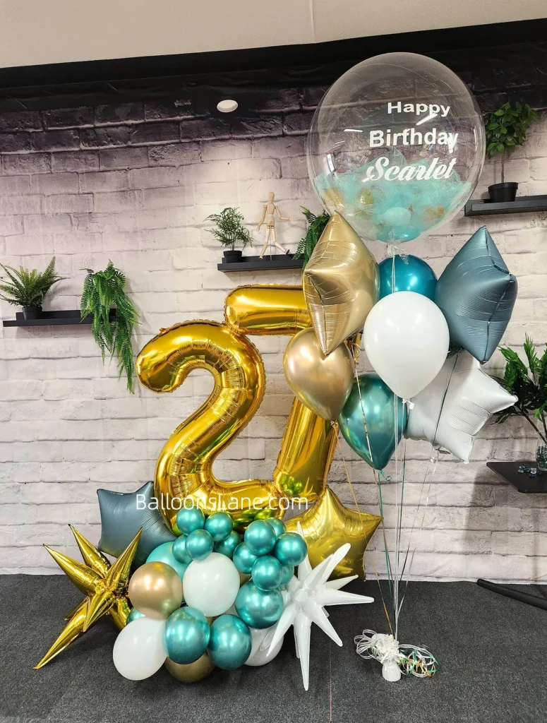 27 number balloon along with gold star, white star, sea green gold balloon along with clear customized balloon arranged in bouquet in Brooklyn