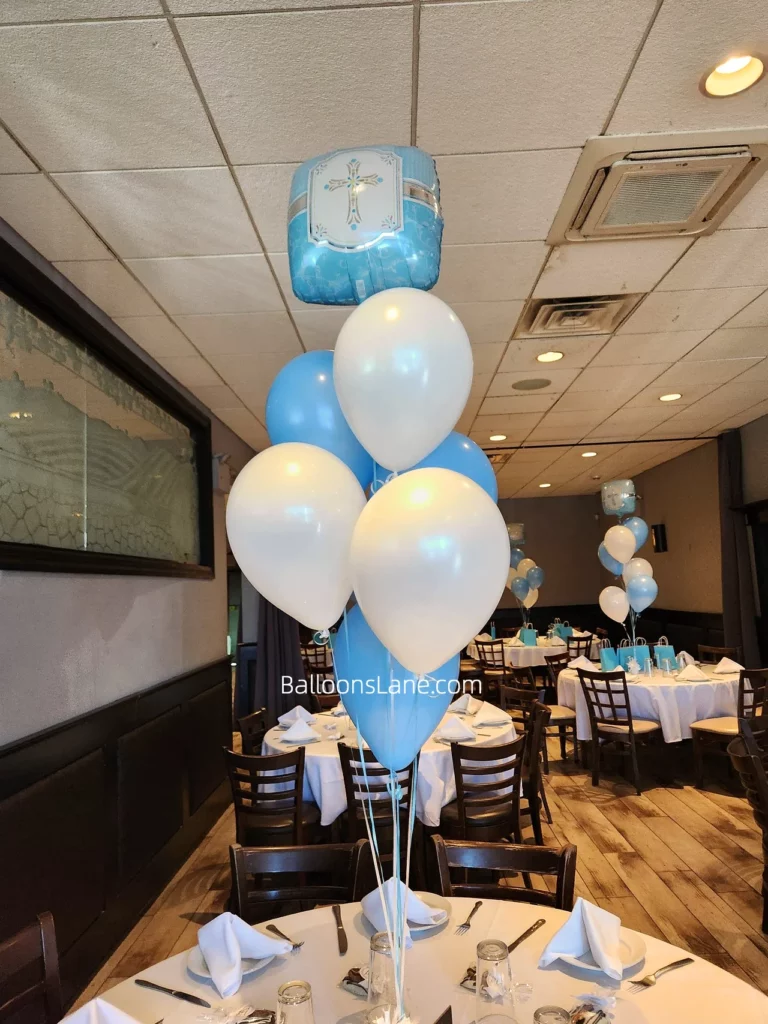 Balloon bouquets for Christening featured white, Caribbean blue, and navy balloons with a big cross Mylar balloon in Staten Island.