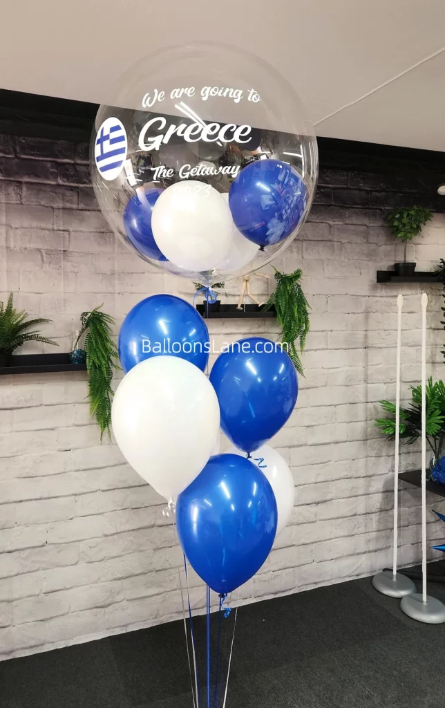 "We are going to Greece" customized balloon bouquet with white and blue balloons in Brooklyn